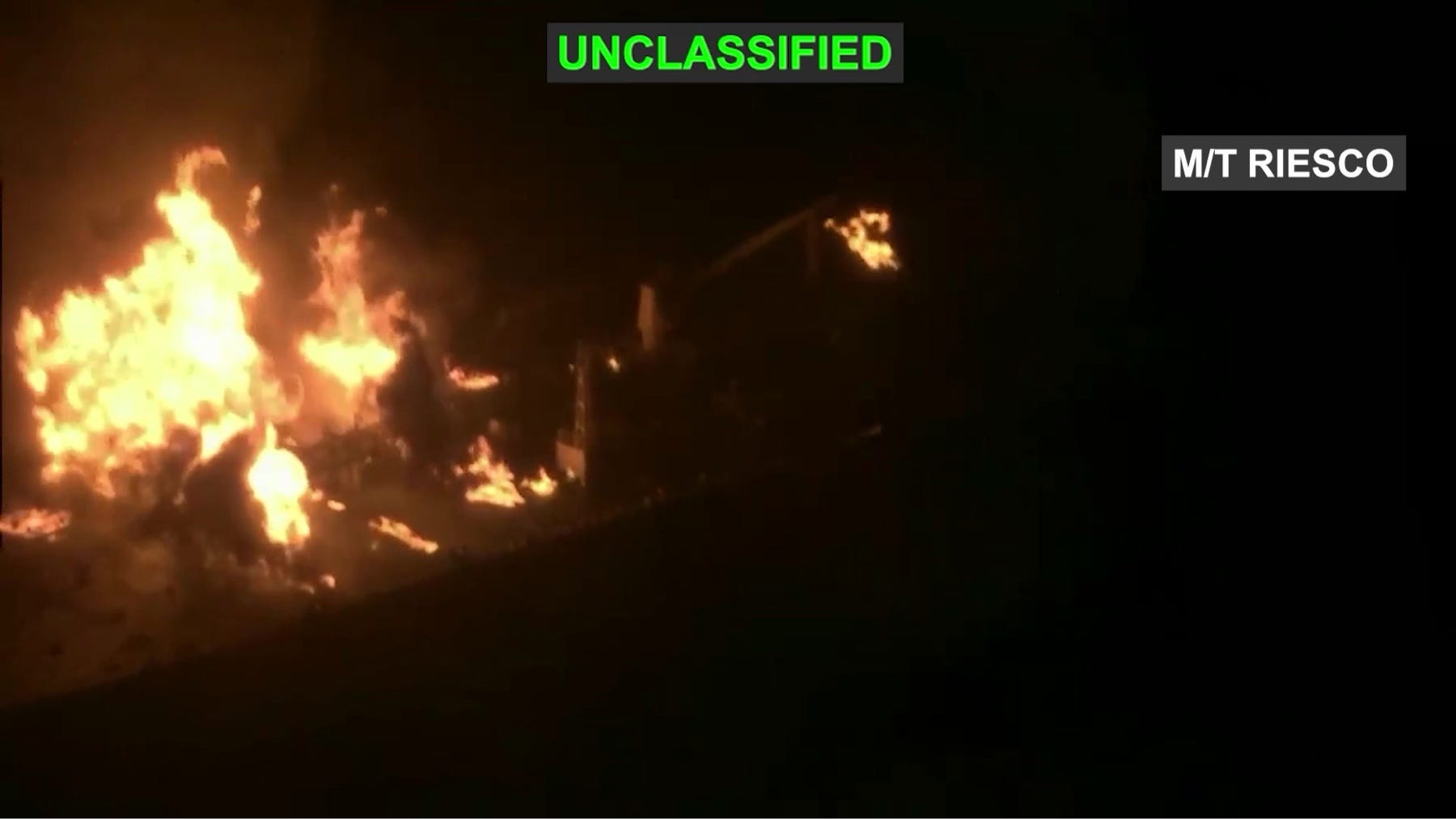 A still from U.S. Central Command footage showing a burning vessel